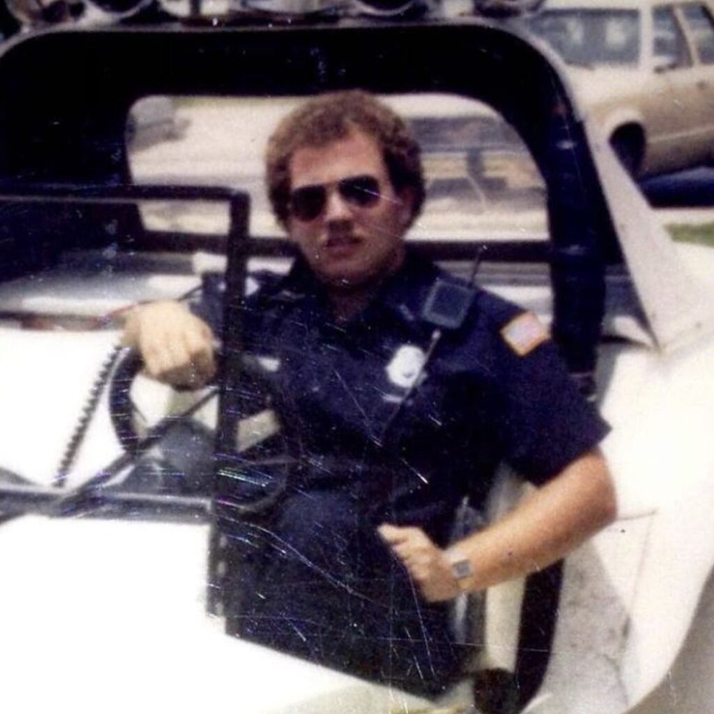 FASRO history - officer driving car in vintage photo