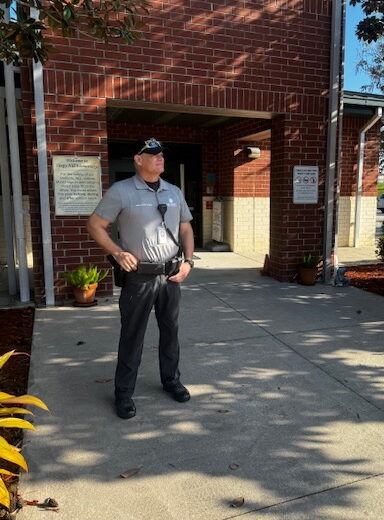 guardian standing outside school